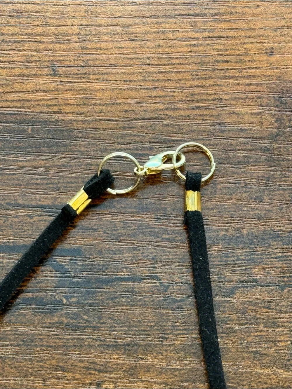 Handmade Dark Gray Granite Stone Arrowhead Pendant on Black Suede Cord